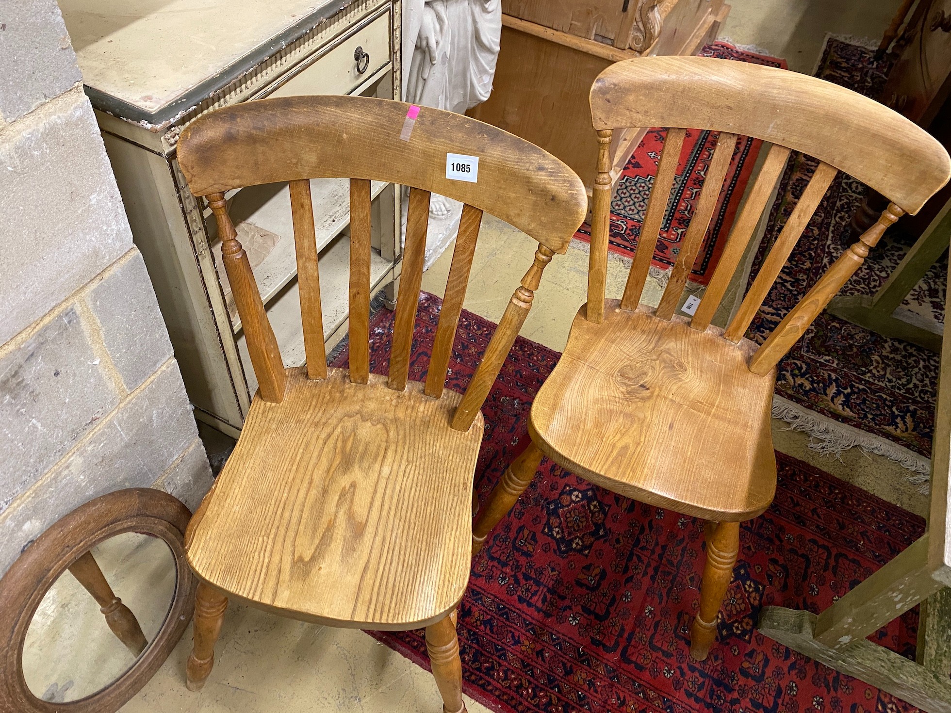 A set of four lathe back kitchen dining chairs